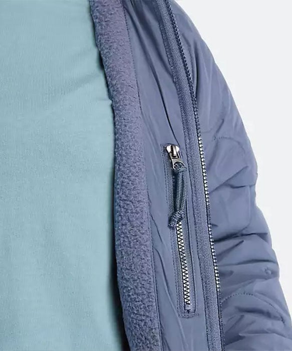 Image of the side of a jacket, folded back to see the fleece lining.