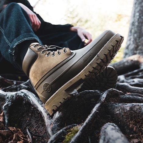 Person wearing Timberland Waterproof Boots in wooded setting.